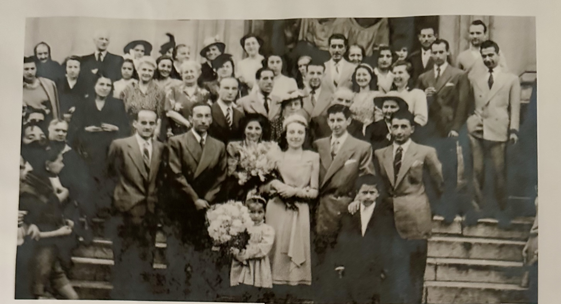 My maternal Grandparents, Guglielmo Scotto Ivaldi and Elda Scotto Busetto, on their wedding day in Genoa, Italy, surrounded by family.