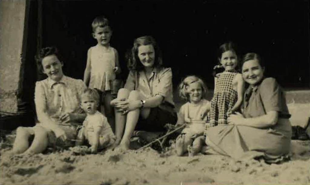 At beach with Keppel Family, Lucy in centre and Judith to her left. (Judith won £ 1 million on English TV quiz show. Restored family fortune.)